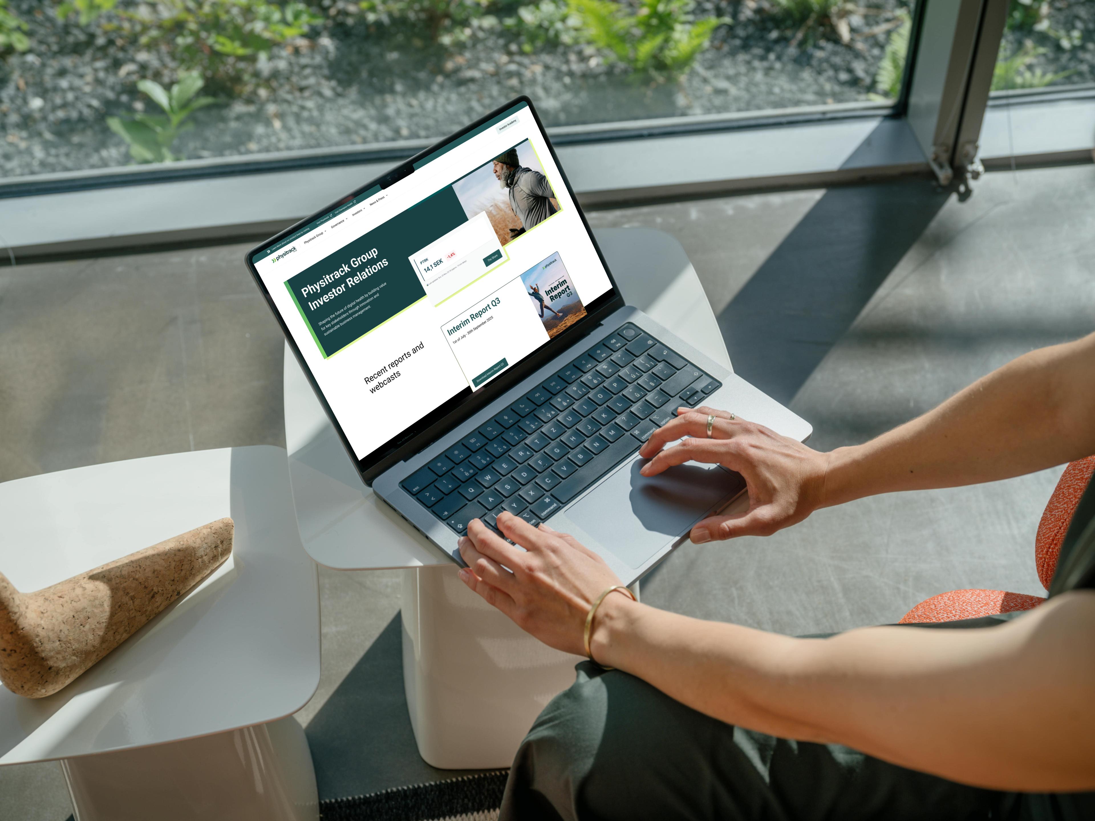 Physitrack Group investor relations website shown on a laptop